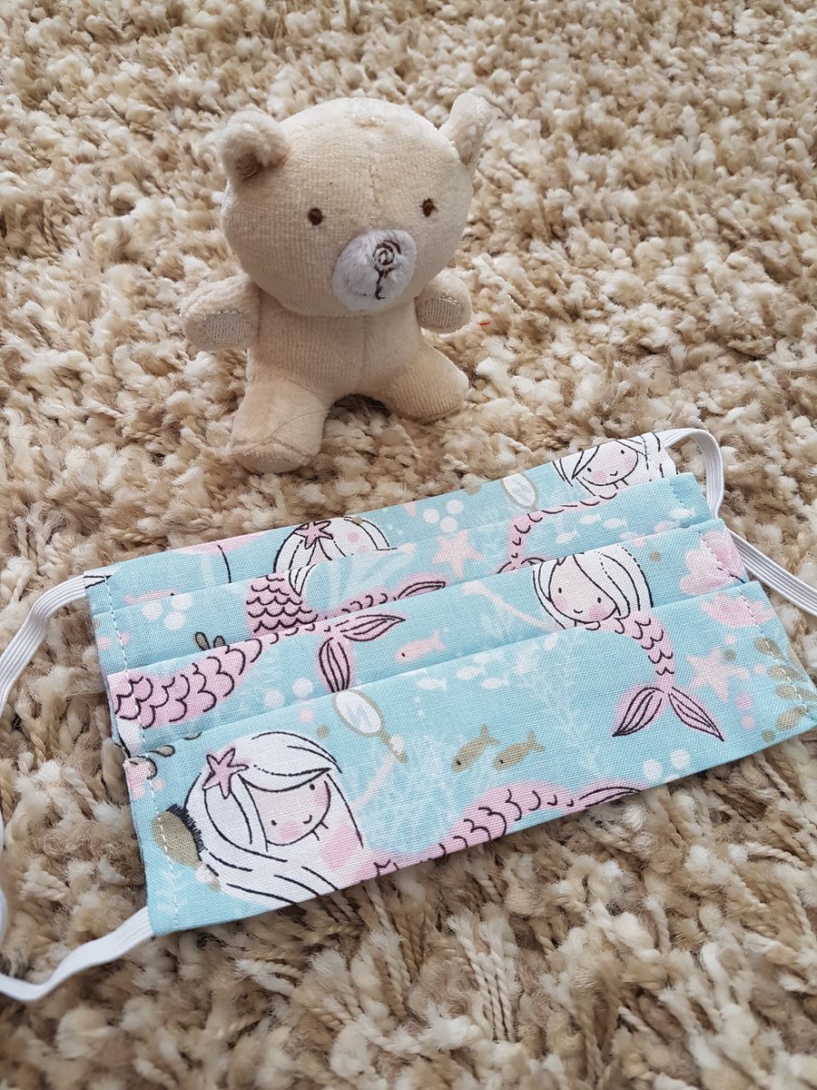 Child face covering – light blue mermaid print material