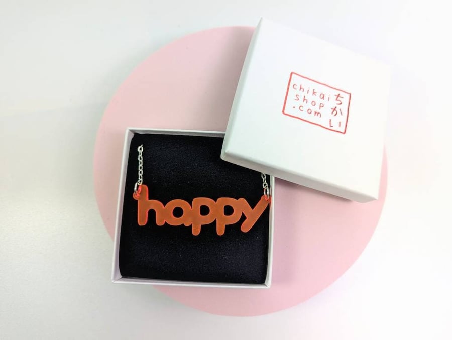 happy necklace on neon pink translucent acrylic with silver plated chain