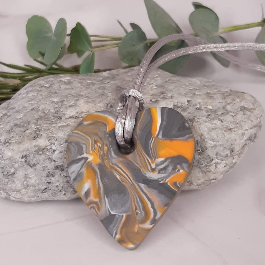 Heart shaped polymer clay pendant