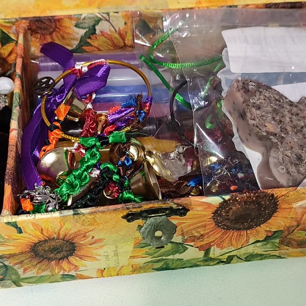 sunflower storage box filled with goodies candles witches bells jeweller crystal
