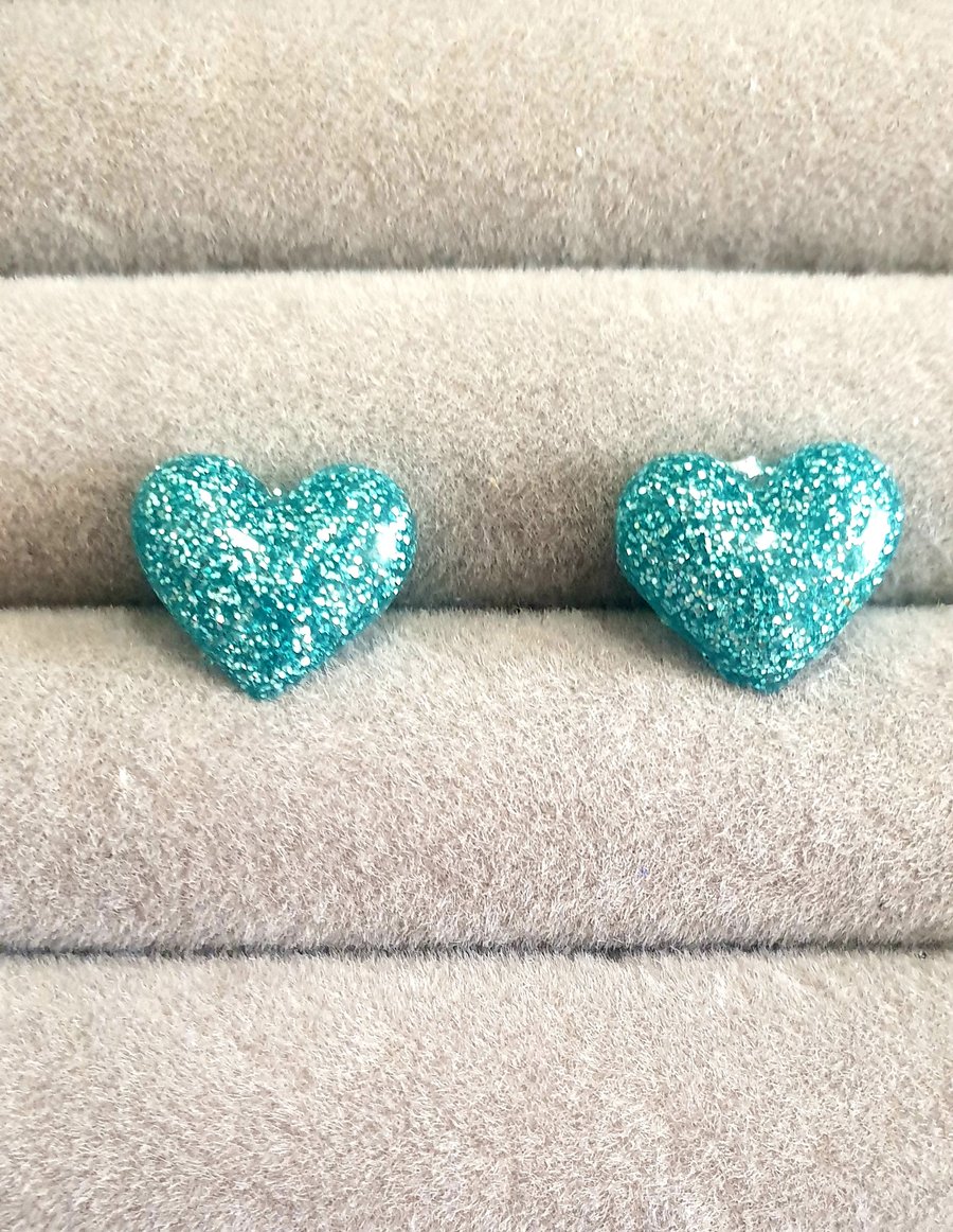 Small pale blue glitter heart stud earrings