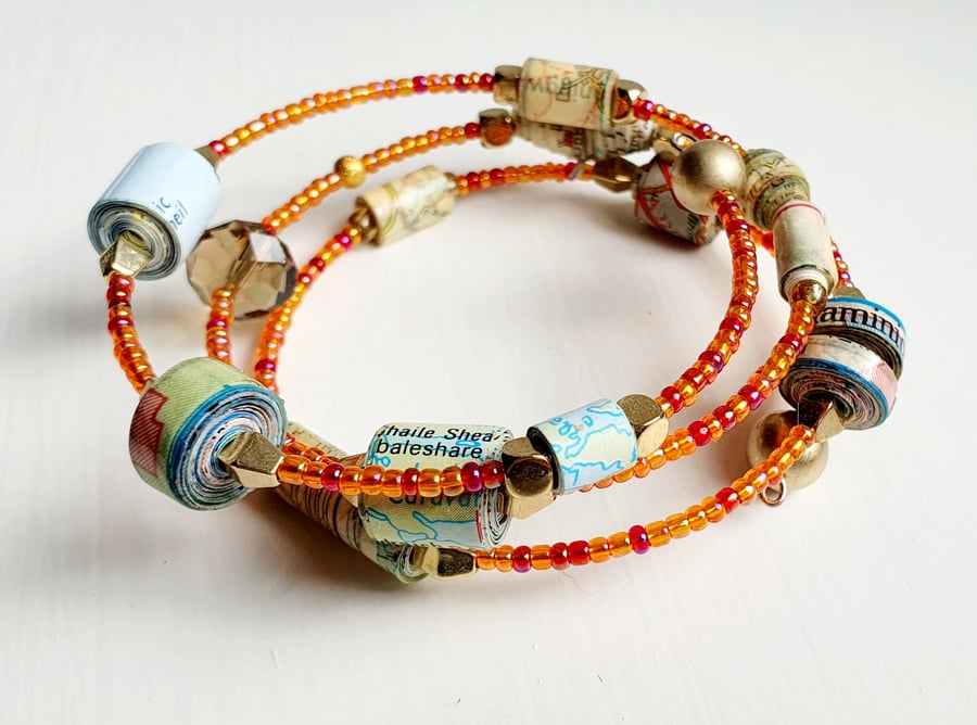 Memory wire bracelet made with paper beads and preloved beads