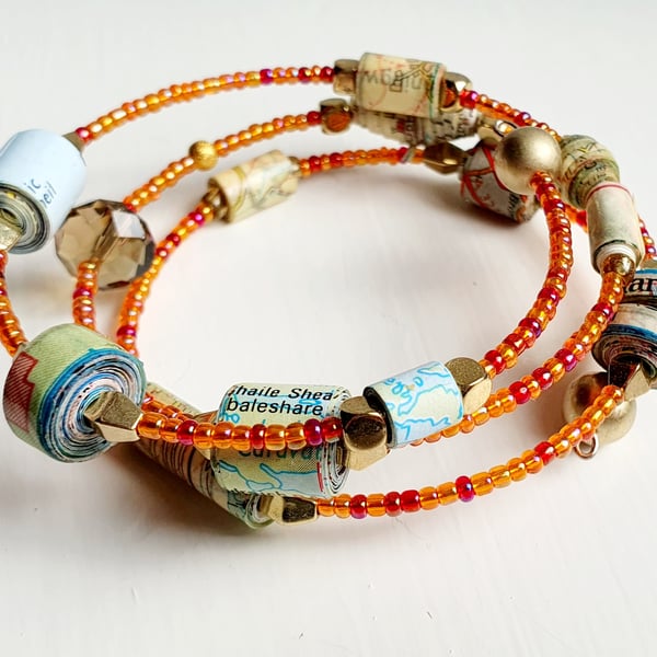 Memory wire bracelet made with paper beads and preloved beads