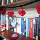 Crocheted red heart bunting decoration
