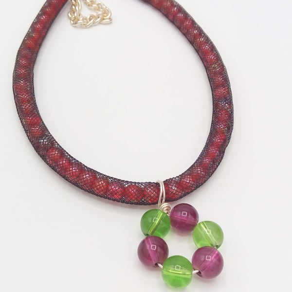 Green and Purple Wire Wrapped Pendant on a Red Bead Netted Necklace