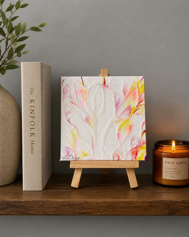 Easel mounted acrylic painted canvas in pinks