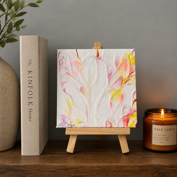 Easel mounted acrylic painted canvas in pinks