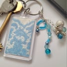 Blue and silver bag charm, keyring, zip pull.