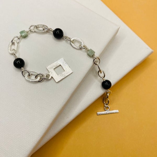 Type A Burmese jadeite bracelet with silver plated ovals