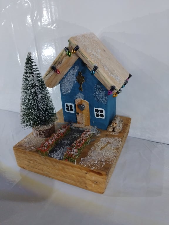 Snowy blue festive cottage!