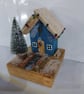 Snowy blue festive cottage!