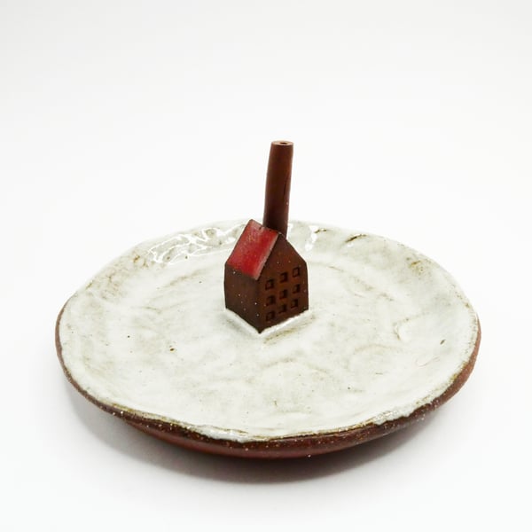 Little factory ring dish made from dark terracotta with a white and red glaze.