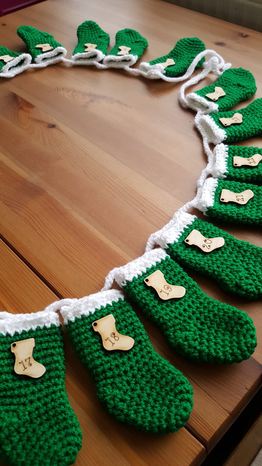 festive crocheted christmas stocking garland, green