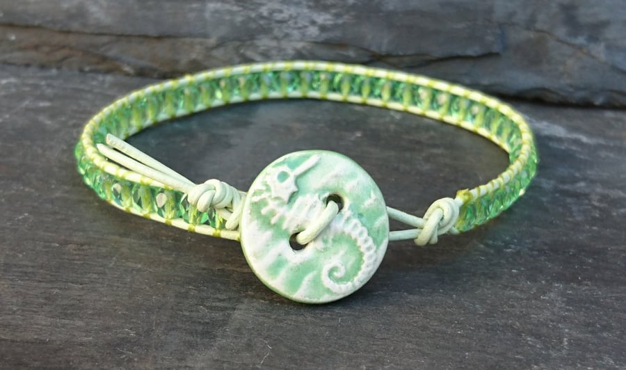 Pale green leather and glass bead bracelet with ceramic seahorse button