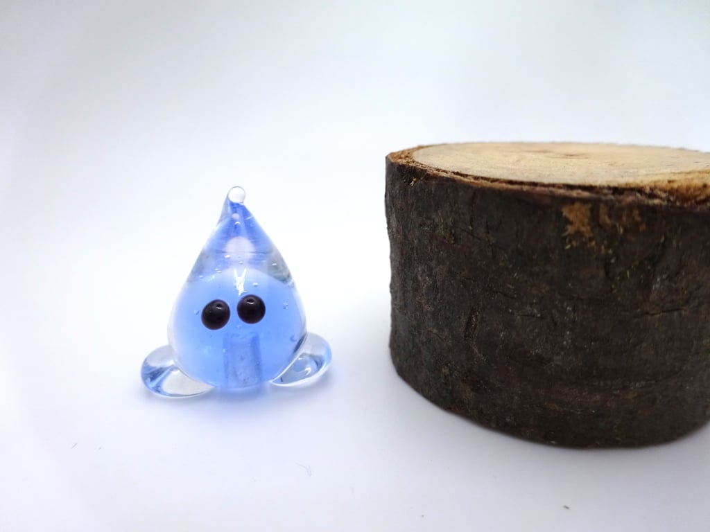 small glass wisp figure