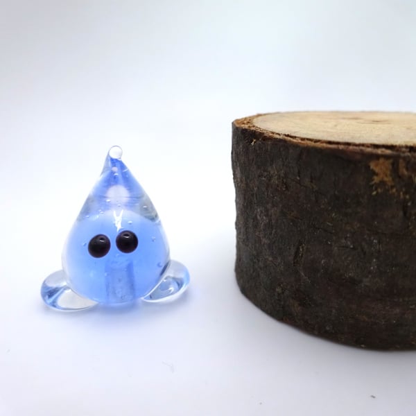 small glass wisp figure