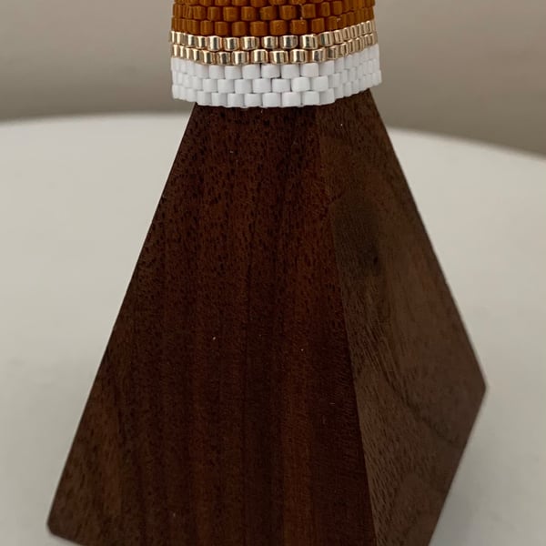 Light brown and white beaded ring