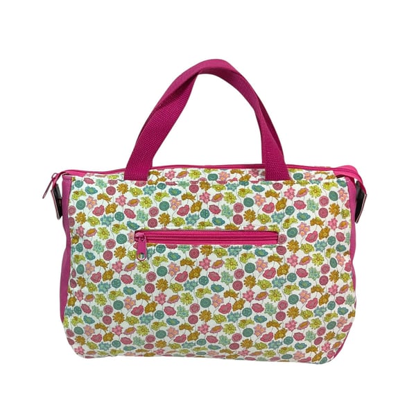 large toiletries bag made from  Liberty fabric, with handles and pockets in and 