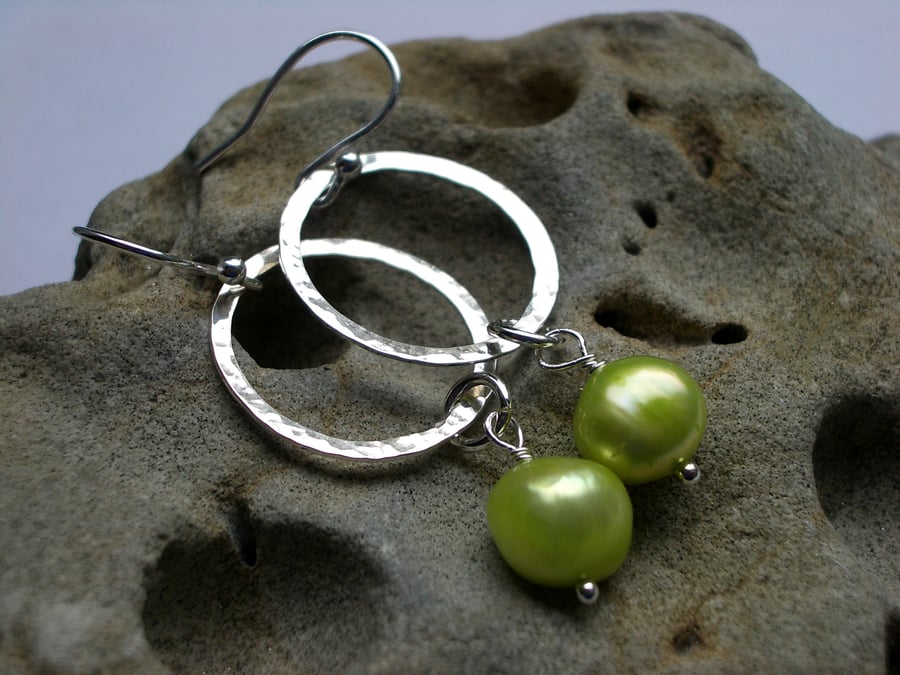 Silver hoop hammered earrings with pistachio green pearls