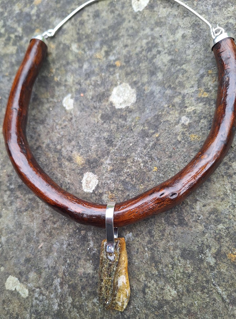 Unique necklace from driftwood and natural amber.