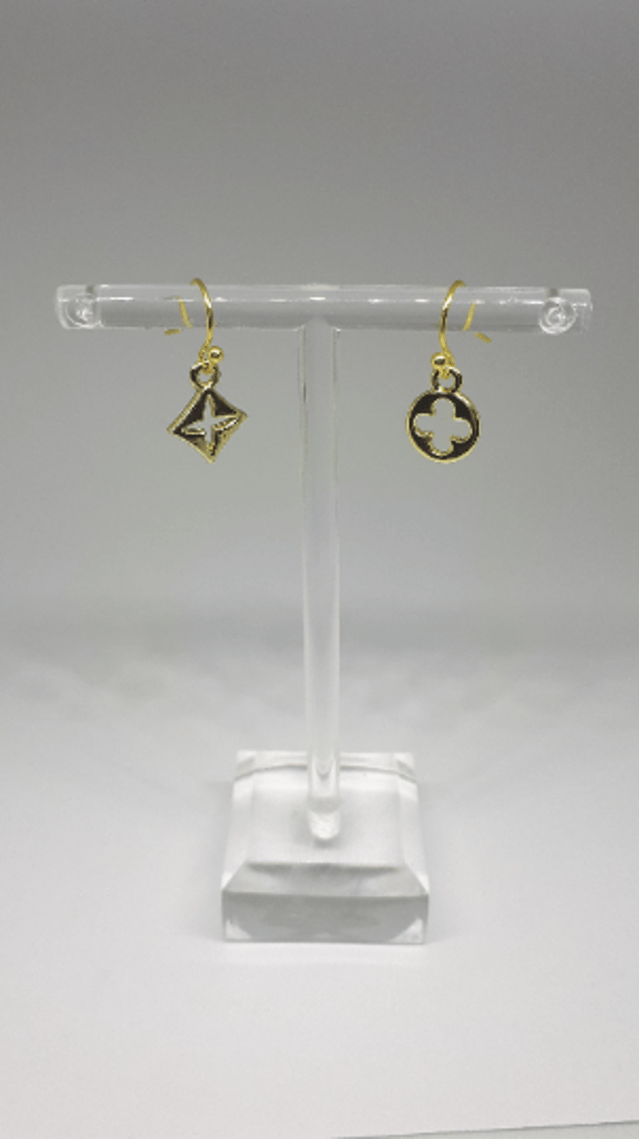 Gold plated hook dangle earrings with motif charms
