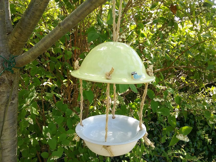 Hand made ceramic yellow and grey bird feeder with hand crafted and painted bird