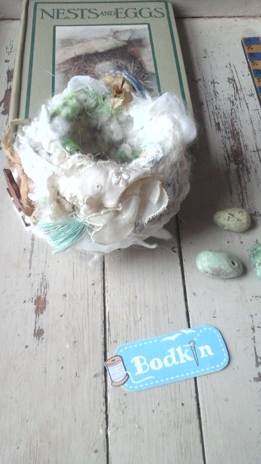 soft crocheted nest,white with hits of green