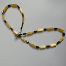 Art deco style black crystal & yellow cats eye beads single strand necklace
