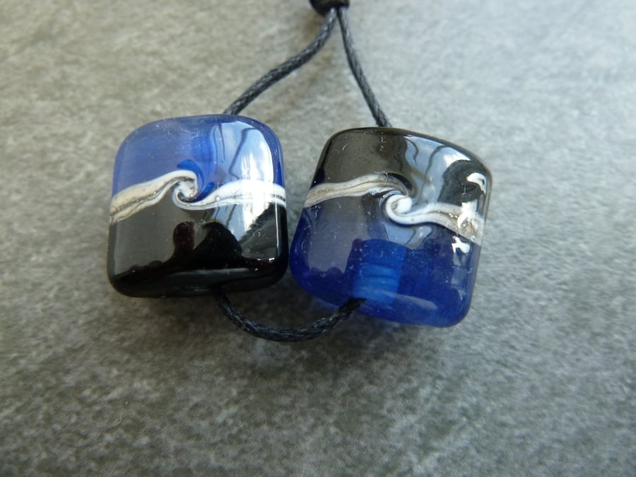 lampwork glass beads, blue and black pair