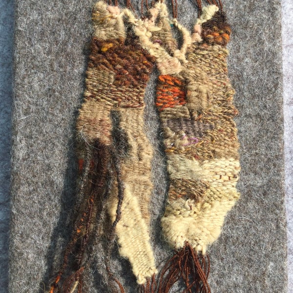Mounted handwoven tapestry weaving,  textile art in browns, orange  and cream