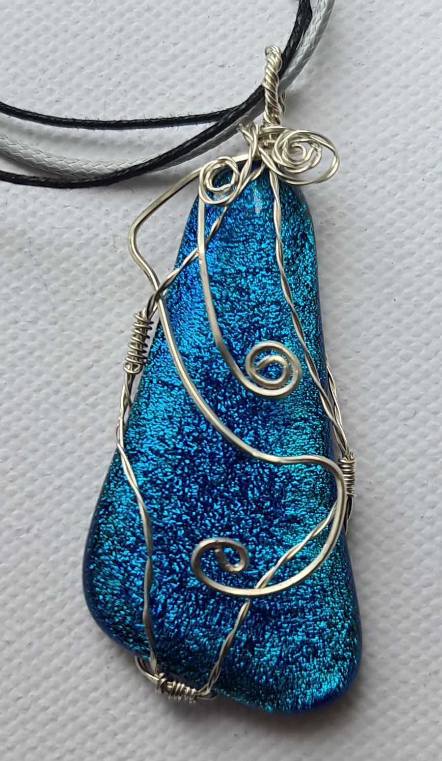 Beautiful dichroic glass cabochon pendant.