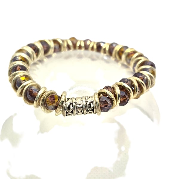 Goddess style stretcbracelet with puple glass beads and silver plated jump rings