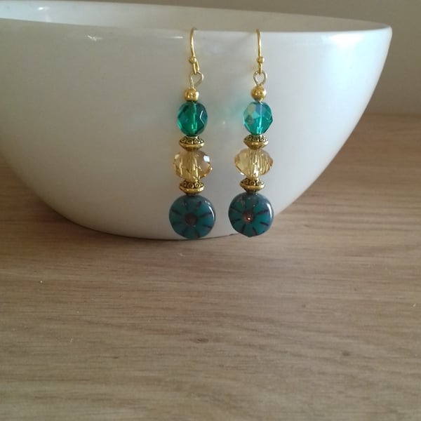 TEAL AND GOLD FLOWER GLASS BEAD EARRINGS.
