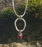 Textured Circle Silver Pendant with Ruby Drop