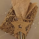 Medium-sized dried flower bouquet tied and wrapped in a sparkle hessian wrap.