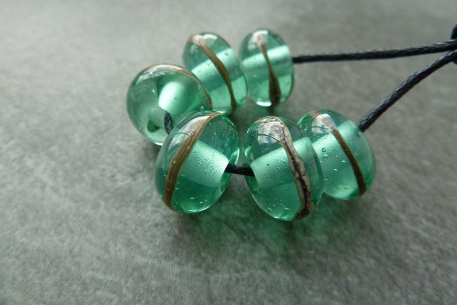 green wrapped lampwork glass beads