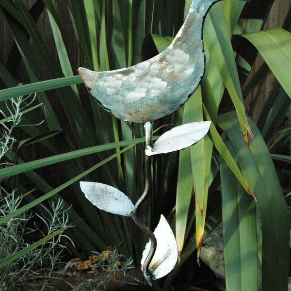 Sculptured metal duck with leaves plant support