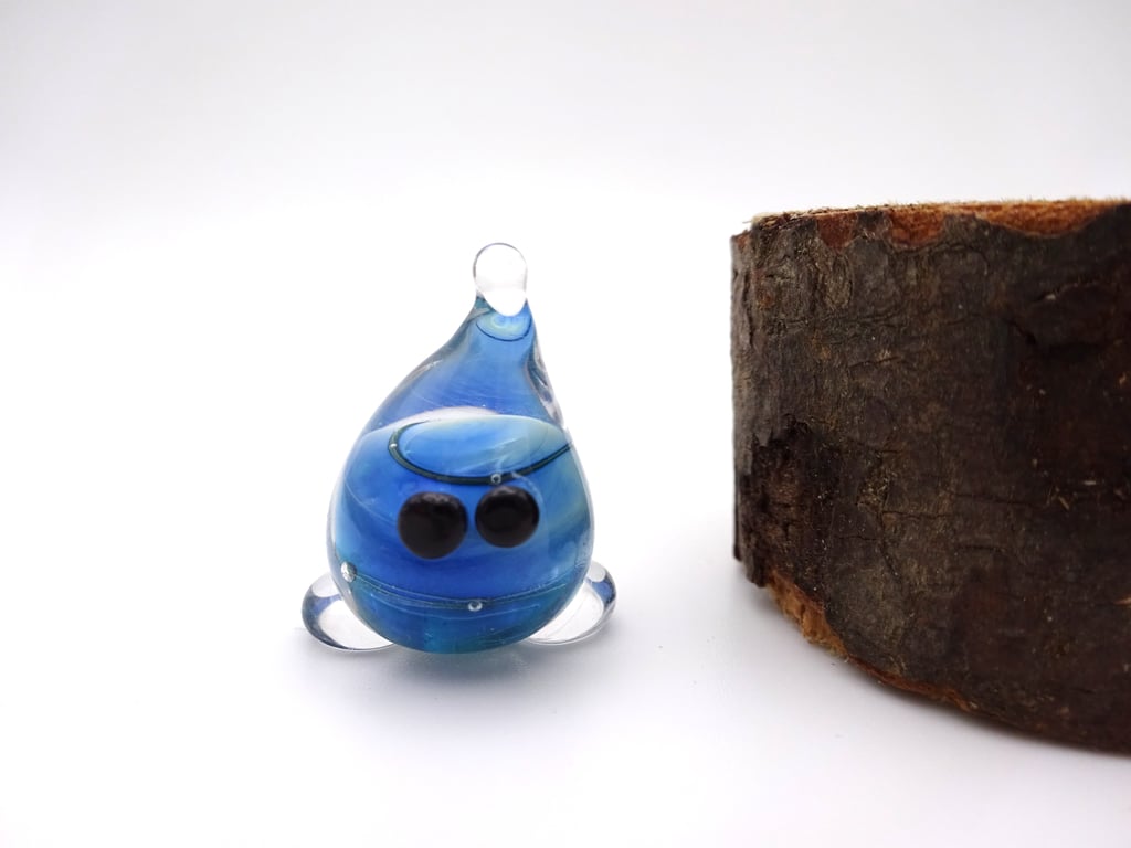 small green blue wispy glass wisp figure