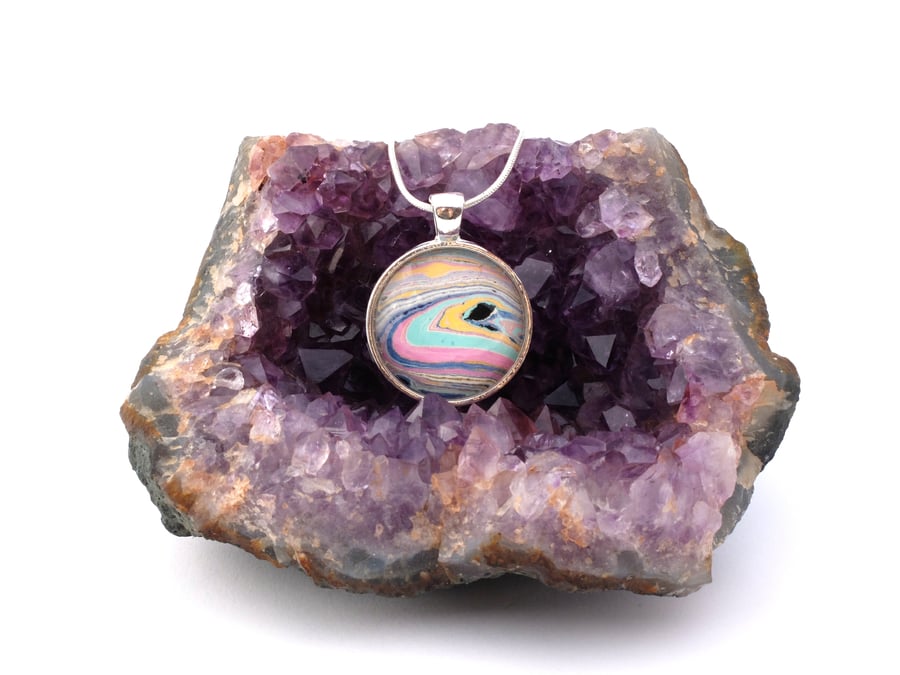 Marbled paper glass cabochon pendant inspired by Saturn