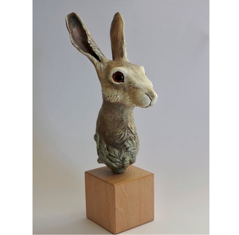Unique hand crafted Sculpture of a Hare fixed on a wooden plinth