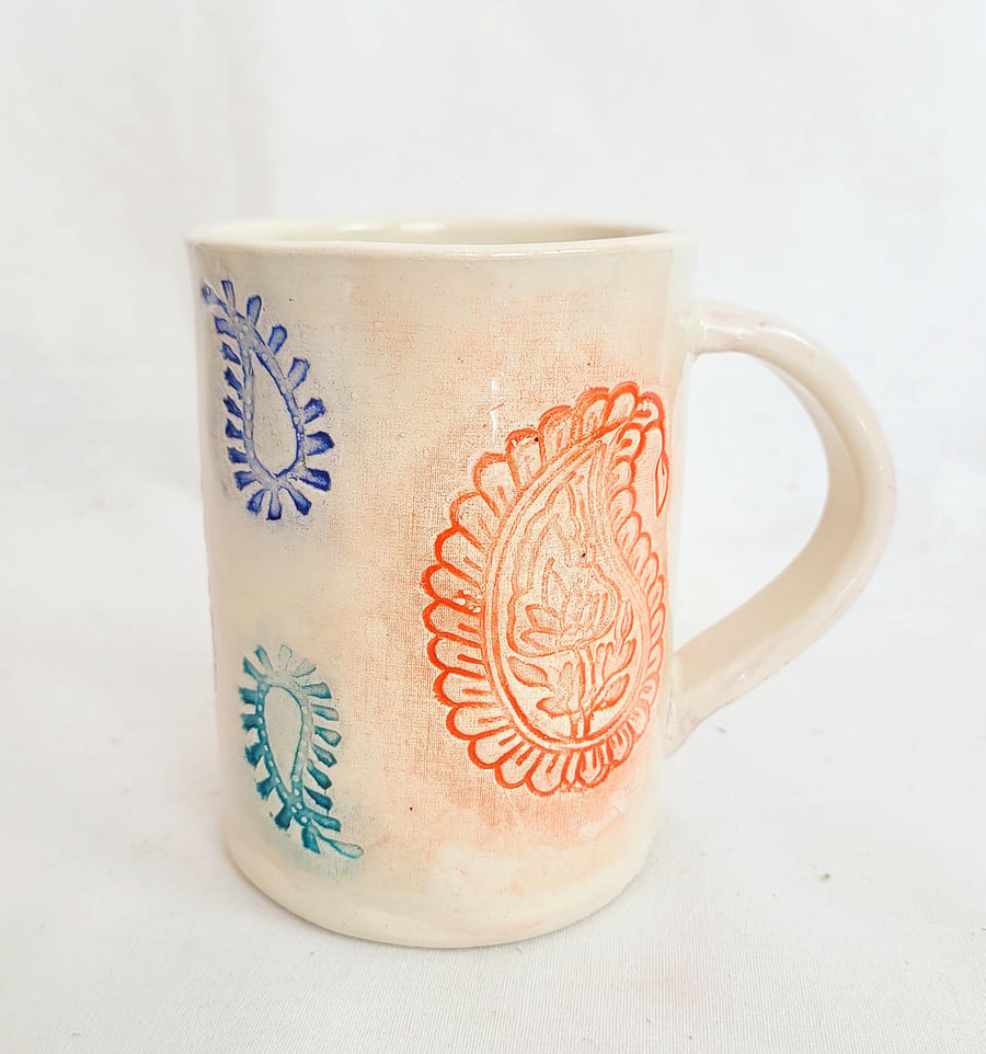 Handmade Paisley Stamped Pottery Mug: Pink, Orange, Blue, and Teal
