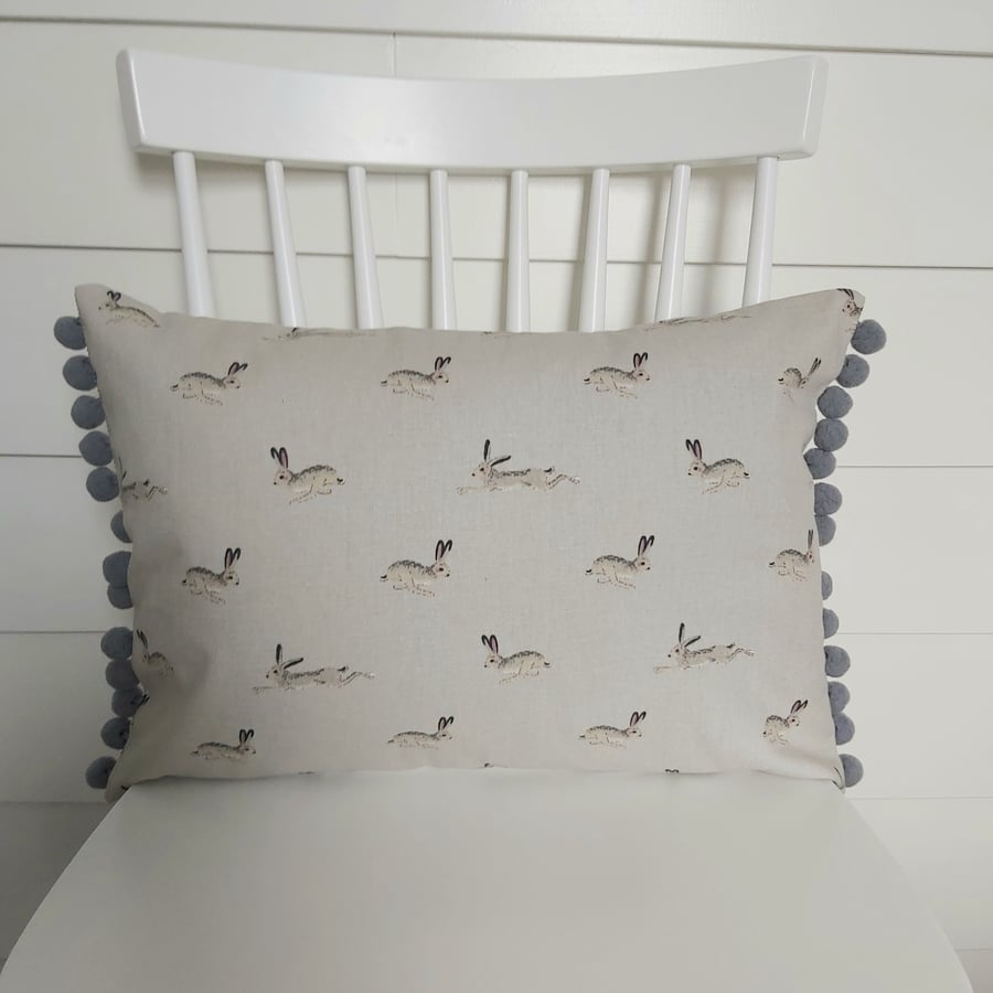 Sophie Allport Hares  Cushion with Dark Grey Pom poms