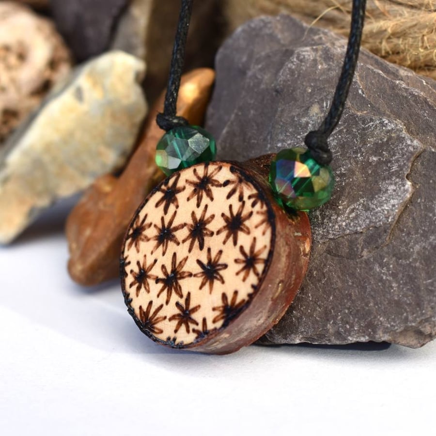 Rustic daisy pyrography pendant, branch slice necklace with beads. 