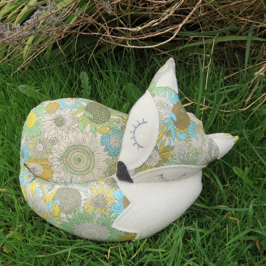 A snoozy fox doorstop, made from Liberty Lawn.