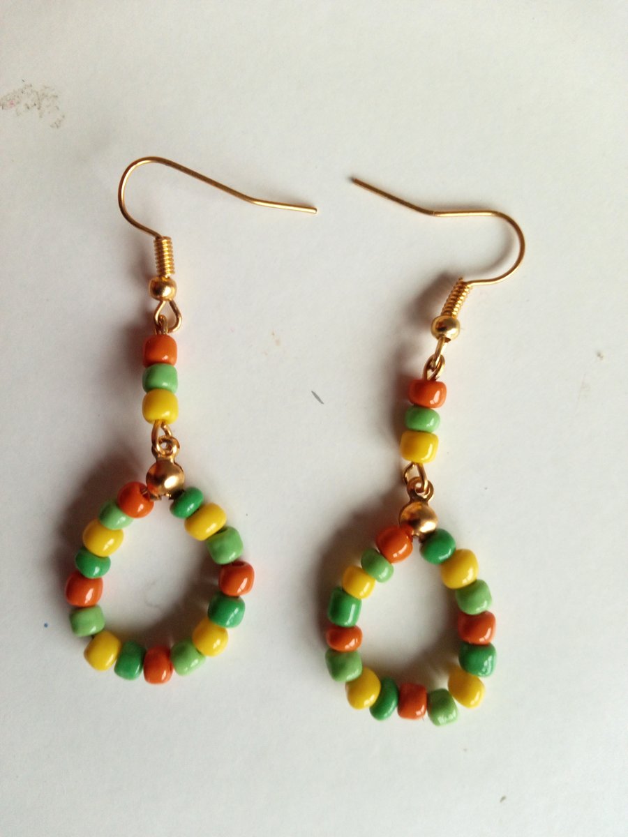 Earrings Multi color Beads and gold stainless steel dangle. 