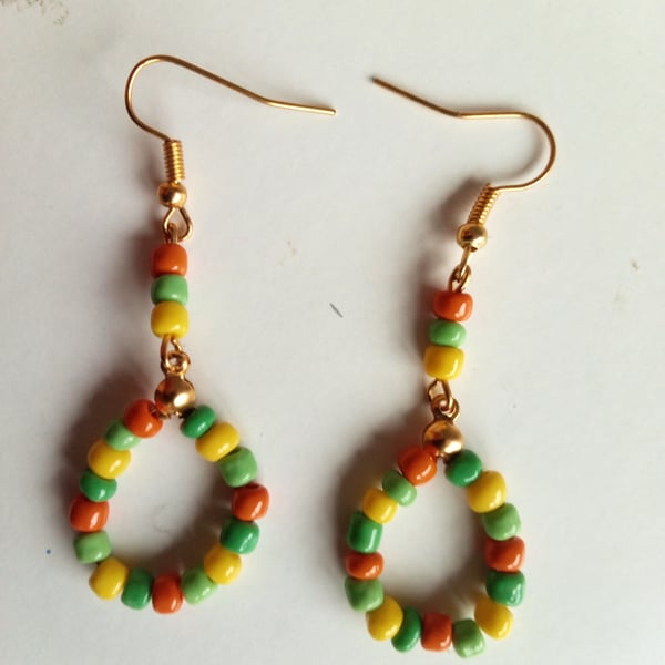 Earrings Multi color Beads and gold stainless steel dangle. 