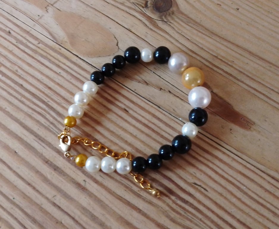 Handmade bracelet made using pre-loved beads.