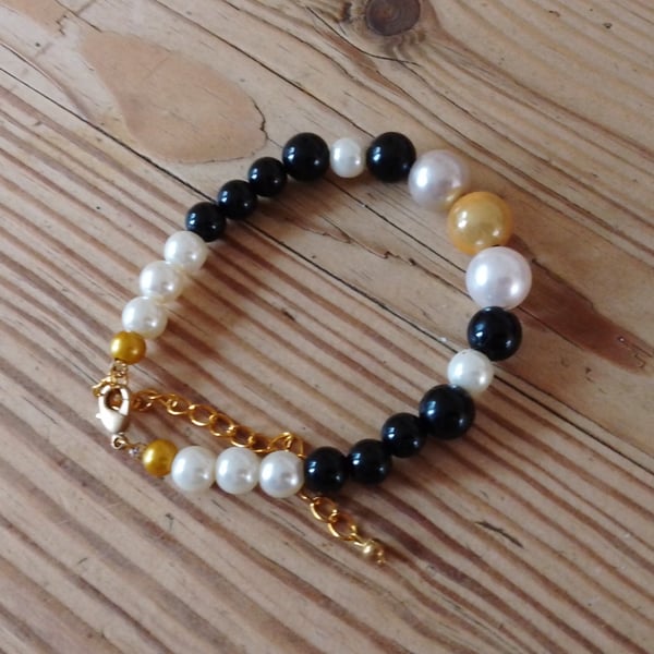 Handmade bracelet made using pre-loved beads.