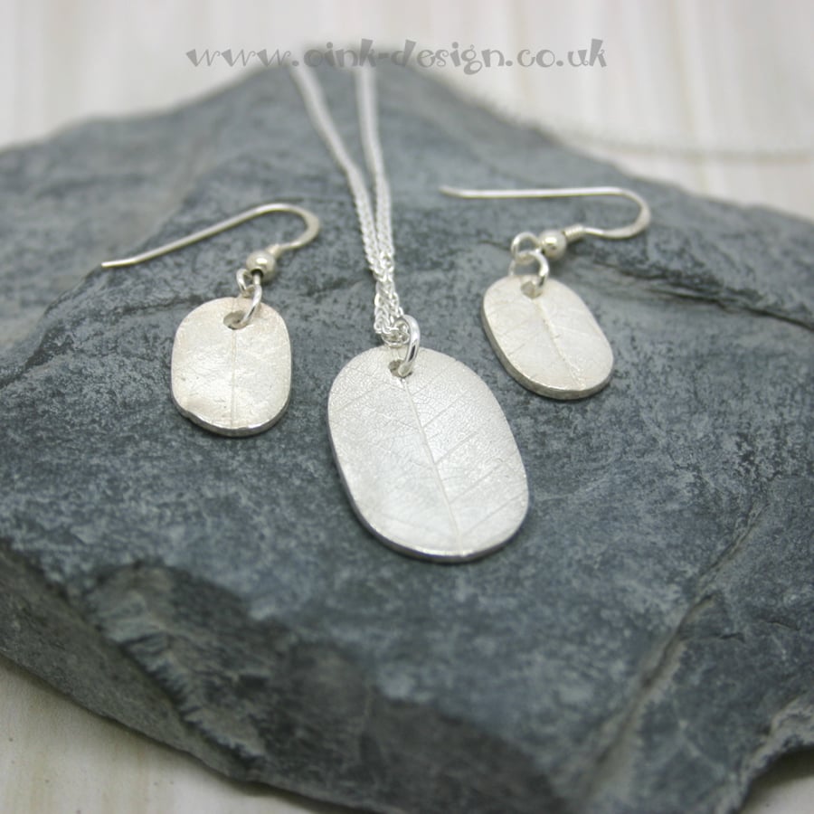 Fine silver necklace and earring set.