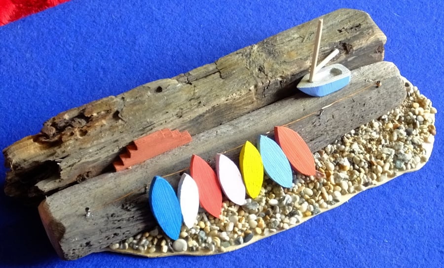 Harbourside quayside wall scene surfboards dinghy pebble beach Cornish driftwood